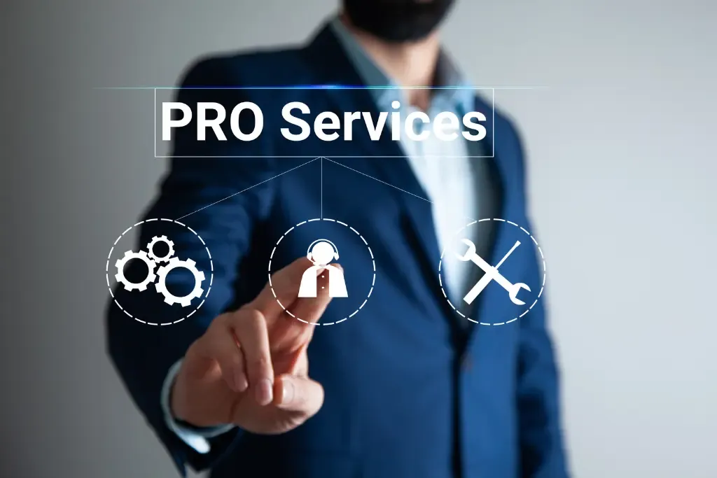  setting up a business in dubai - Man in a suit pointing at a 'PRO Services' hologram with icons for gears, person, and tools.